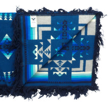 Load image into Gallery viewer, Pendleton Chief Joseph Blanket in Aegean featuring a traditional Native American-inspired geometric pattern with arrow motifs, folded neatly to show intricate design and soft wool texture, Inside View