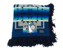 Load image into Gallery viewer, Pendleton Chief Joseph Blanket in Aegean featuring a traditional Native American-inspired geometric pattern with arrow motifs, folded neatly to show intricate design and soft wool texture. front View