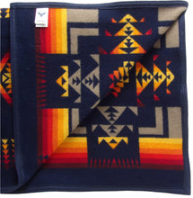 Load image into Gallery viewer, Pendleton Chief Joseph Blanket in Indigo, featuring a traditional Native American-inspired geometric pattern with arrow motifs, folded neatly to show intricate design and soft wool texture. Inside View