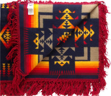 Load image into Gallery viewer, Pendleton Chief Joseph Shawl in indigo, featuring a traditional Native American-inspired geometric pattern with arrow motifs, folded neatly to show intricate design and soft wool texture. Inside view