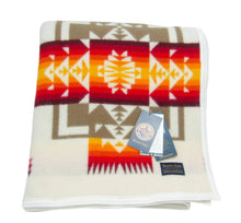 Load image into Gallery viewer, Pendleton Chief Joseph Blanket in Ivory featuring a traditional Native American-inspired geometric pattern with arrow motifs, folded neatly to show intricate design and soft wool texture. front View