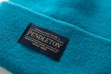 Load image into Gallery viewer, Close-up of Pendleton tag on teal beanie