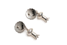 Load image into Gallery viewer, Pair of circular silver earrings with dangling silver shaped like flower stems a white background