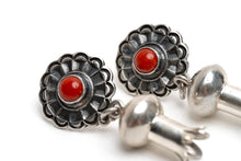 Load image into Gallery viewer, Close up of a pair of silver earrings with a single coral stone in the center of silver shaped like a blossom on a white background