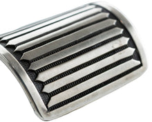 Load image into Gallery viewer, Close up of straight line stamp work on a Navajo silver bracelet cuff