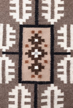 Load image into Gallery viewer, Close up of a Navajo handwoven rug with geometric pattern featuring brown, beige, and white colors.
