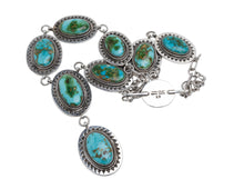 Load image into Gallery viewer, Native American sterling silver necklace with turquoise stones on a light gray background