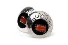 Load image into Gallery viewer, Pair of circular Native American silver and coral shadow box earrings leaning against each other on a white background