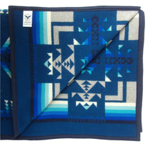 Load image into Gallery viewer, Pendleton Chief Joseph Blanket in Aegean featuring a traditional Native American-inspired geometric pattern with arrow motifs, folded neatly to show intricate design and soft wool texture, inside view