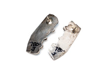 Load image into Gallery viewer, The back side of a pair of Native American silver stamped earrings with turquoise stones on a white background