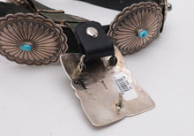 Load image into Gallery viewer, Close-up of a belt with concho details and a visible brand label on a white background