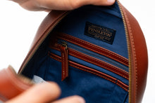 Load image into Gallery viewer, Close-up of a Pendleton leather bag with open zipper showing blue interior.