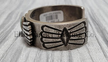 Load image into Gallery viewer, Heavy silver bracelet, with a center Carico Lake Turquoise stone, with an overlay design, on top of a shiny silver sheet side view