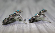 Load image into Gallery viewer, Cluster-style sterling silver clip-on earrings side view, displayed on a black card against a silver satin background.