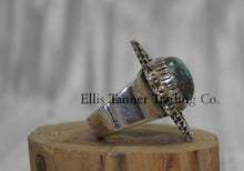 Load image into Gallery viewer, Silver Ring ,zigzag 14k overlay with round Bisbee turquoise in center, on a wooden display side