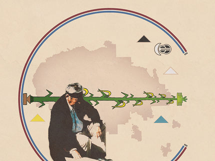 A Navajo Medicine man wearing a black headband is sitting with a map of the current borderlines of the Navjo Nation behind him. Around the map of the navajo nation are the four sacred mountains