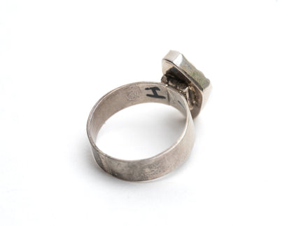 Inside view of Authentic Navajo Kingman turquoise ring on a white background