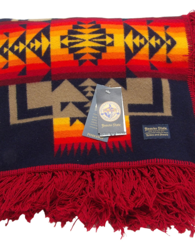 Pendleton Chief Joseph Blanket in indigo, featuring a traditional Native American-inspired geometric pattern with arrow motifs, folded neatly to show intricate design and soft wool texture. Front View 