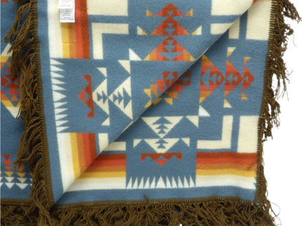 Pendleton Chief Joseph Blanket in Shale featuring a traditional Native American-inspired geometric pattern with arrow motifs, folded neatly to show intricate design and soft wool texture, inside view