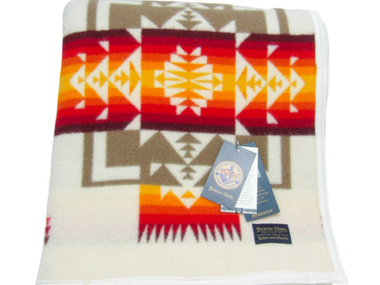 Pendleton Chief Joseph Blanket in Ivory featuring a traditional Native American-inspired geometric pattern with arrow motifs, folded neatly to show intricate design and soft wool texture. front View 
