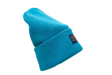 Load image into Gallery viewer, Pendleton teal knitted beanie with a tag on brim back on a white background
