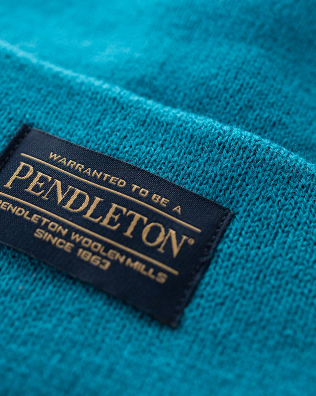 Close-up of Pendleton tag on teal beanie