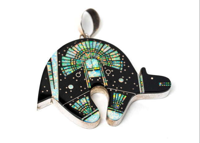 Jet black bear shaped inlay Navajo pendant with a Yei on the surface in opal