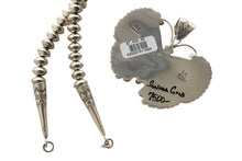 Load image into Gallery viewer, Back of a silver butterfly pendant and the beaded necklace on a white background
