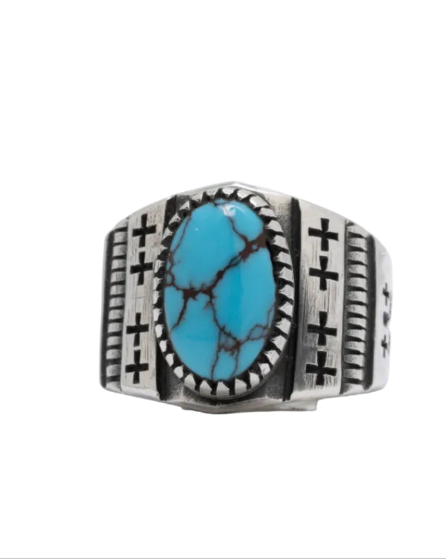 Navajo silver ring with one Egyptian turquoise gemstone on a white background