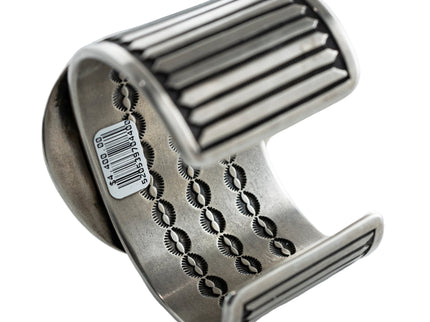 Inside view of a Navajo silver bracelet with intricate stamp work designed inside the bracelet