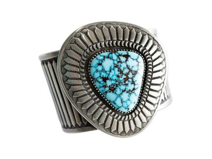Navajo Silver bracelet with a Kingman turquoise gemstone on a white