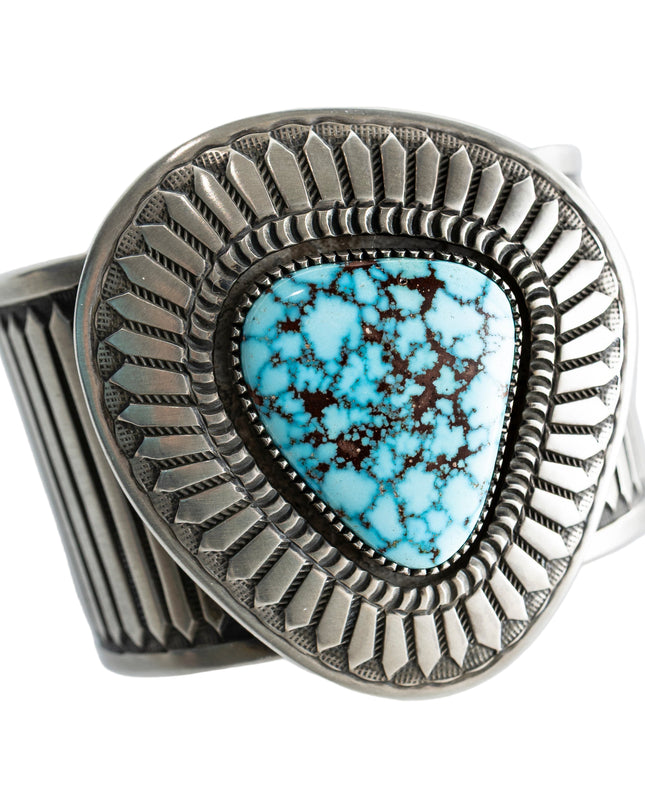 Navajo Silver bracelet with a Kingman turquoise gemstone on a white