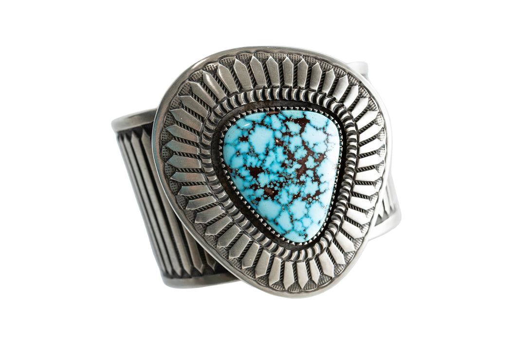 Navajo Silver bracelet with a Kingman turquoise gemstone on a white