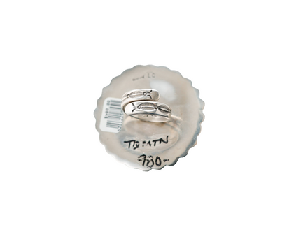 Close up of stamp work on the rind band of a sterling silver ring