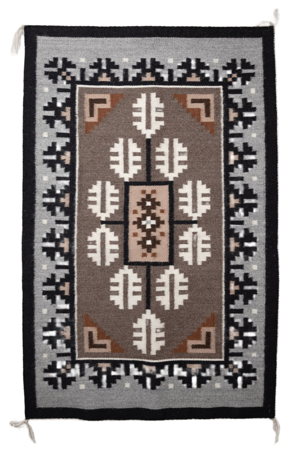 Traditional Navajo handwoven rug with a brown center and a grey and black borden featuring a Navajo geometric patterns
