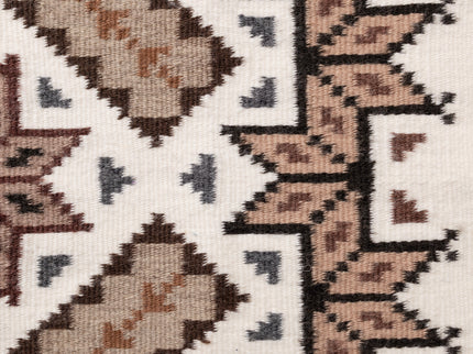 Side close-up of a navajo patterned rug with geometric design