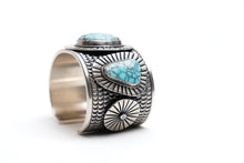 Load image into Gallery viewer, Native American silver cuff bracelet with turquoise stones on a white background
