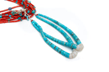 Load image into Gallery viewer, Close up view of single Native American necklace with nine strands of Mediterranean coral with sleeping beauty, Royston and Kingman Turquoise stones, and Lapis on a white background
