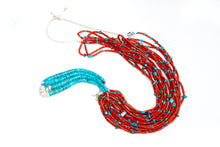 Load image into Gallery viewer, Single Native American necklace with nine strands of Mediterranean coral with sleeping beauty, Royston and Kingman Turquoise stones, and Lapis on a white background

