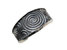 Load image into Gallery viewer, Silver cuff bracelet with spiral pattern on a white background
