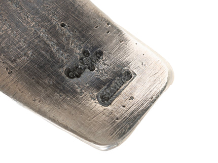 Closeup of artist's Hallmark stamp inside a silver bracelet