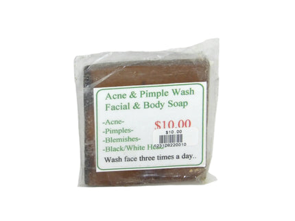 A bar of natural acne and pimple wash soap in clear plastic packaging with a label that includes the product name, price, and information that it helps with blackheads, blemishes, and acne.