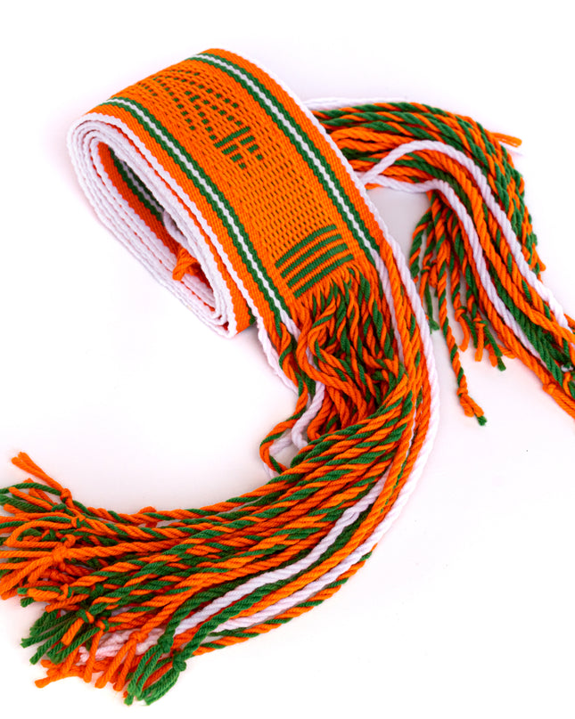 A woven Navajo orange sash belt with green and white stripes, featuring tassels at the ends.