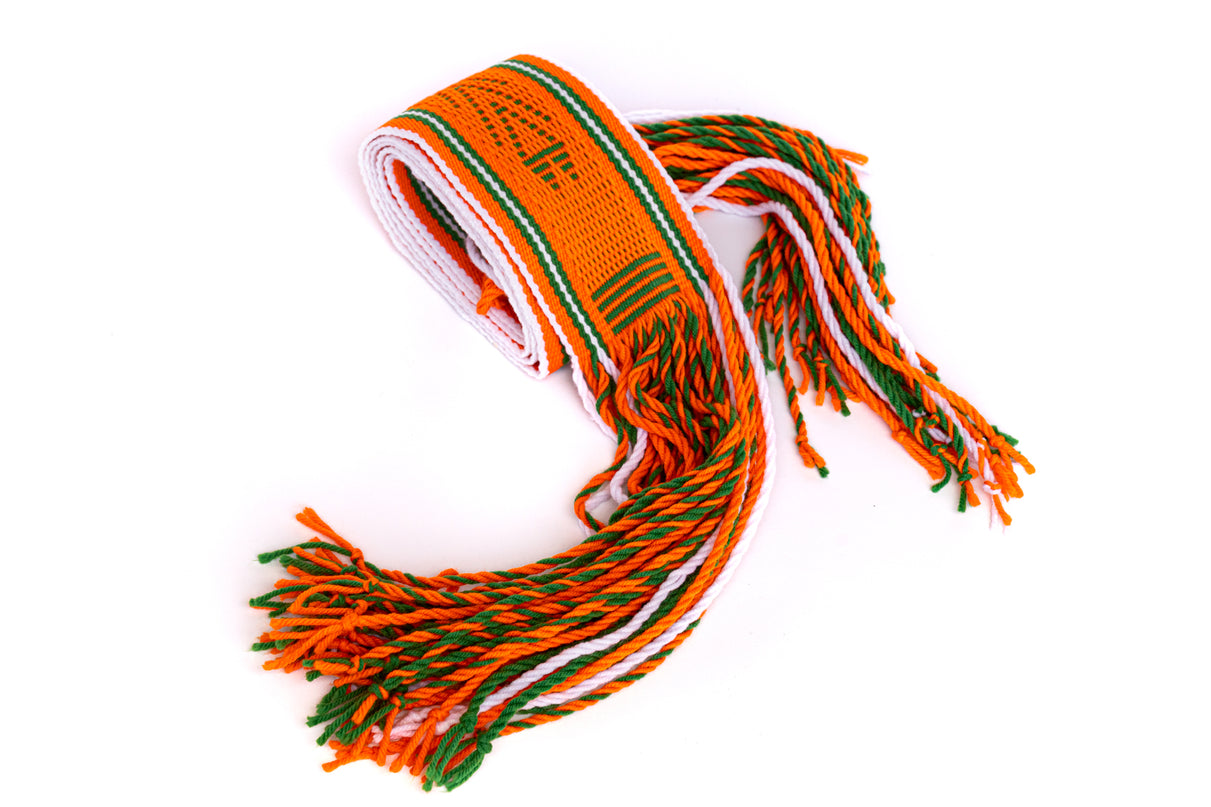 A woven Navajo orange sash belt with green and white stripes, featuring tassels at the ends.