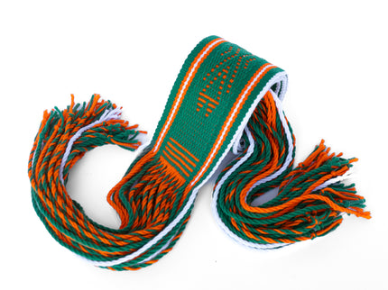 Green and orange Navajo Sash Belt Rolled Up with Fringe Hanging out