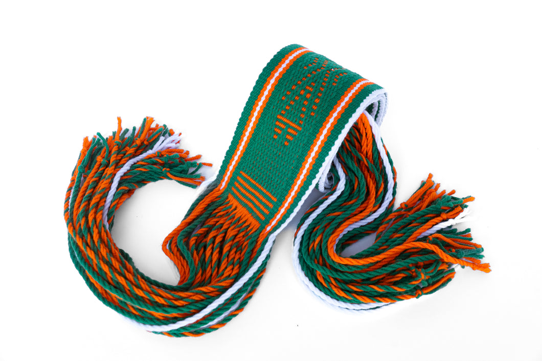 Green and orange Navajo Sash Belt Rolled Up with Fringe Hanging out
