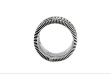 Load image into Gallery viewer, Side profile of a Navajo silver ring with a coin edged band on a white background

