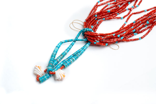 Coral and turquoise beaded necklaces on a white background