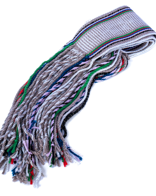 A hand woven Navajo gray and silver sash belt with fringed ends.