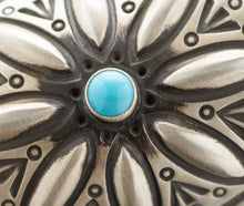 Load image into Gallery viewer, Close up of a Sleeping Beauty turquoise gemstone and hand-stamped pattered around it
